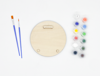 The back of the Sasquatch wood kit showing the included sawtooth hanger, wooden bumpers, paint pots, and brushes
