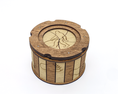 Handcrafted Sasquatch iris box with engraved Bigfoot silhouette on the lid and alternating natural wood and mahogany finish.