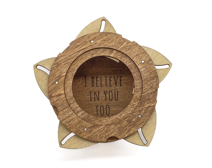 Interior of handcrafted Sasquatch iris box revealing the engraved message I Believe In You Too.