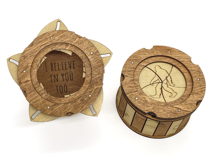 Sasquatch iris box showing hidden message inside and engraved Bigfoot silhouette on the top lid.
