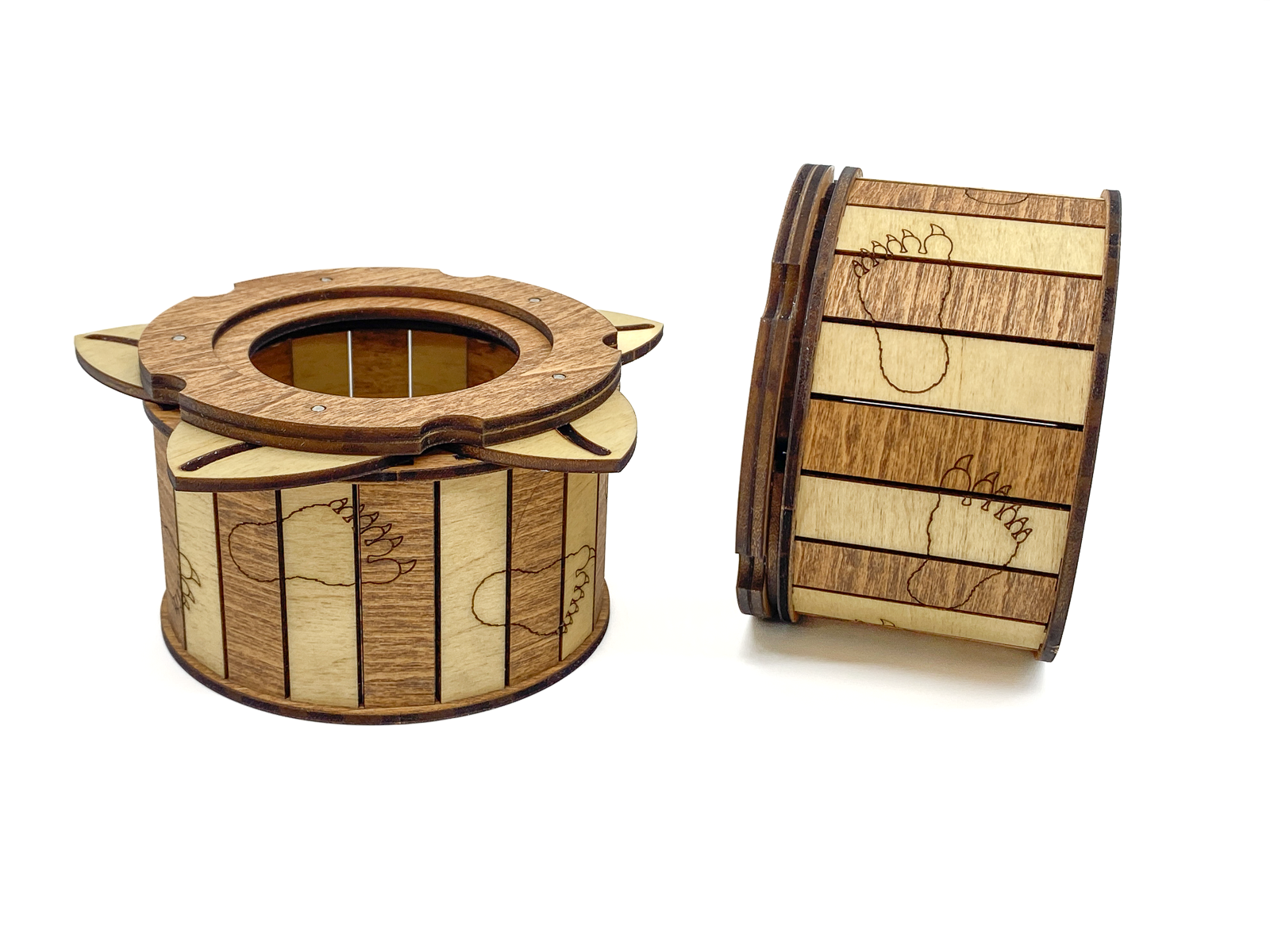 Wooden Sasquatch iris box opened to reveal the rotating iris design and Bigfoot footprint engravings around the sides.