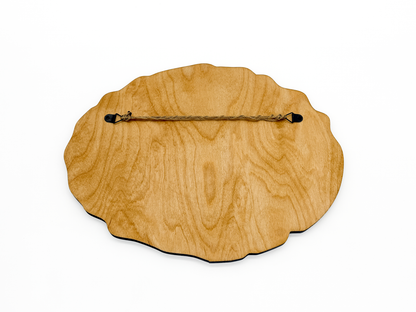 Back view of Sawdust = Man Glitter wooden wall art showing the stained wood finish and attached hanging cord.