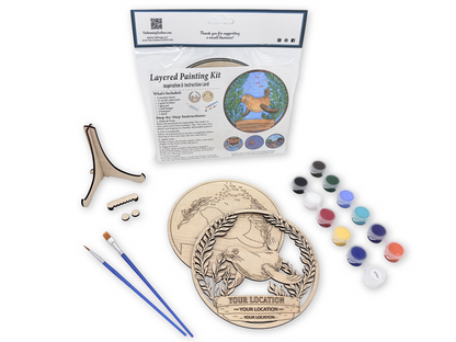 Sea Lion layered painting kit with unfinished wood pieces, paint pots, brushes, glue, display stand, hardware, and packaged guide.