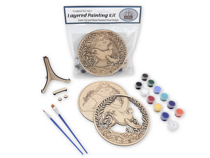 Sea Lion layered painting kit with unfinished wood pieces, paint pots, brushes, glue, display stand, hardware, and instruction card in packaging.