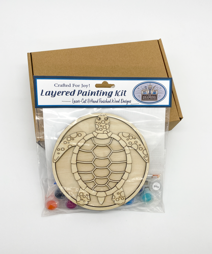 Front of Sea Turtle DIY paint kit packaging showing layered wood sea turtle design and included painting supplies
