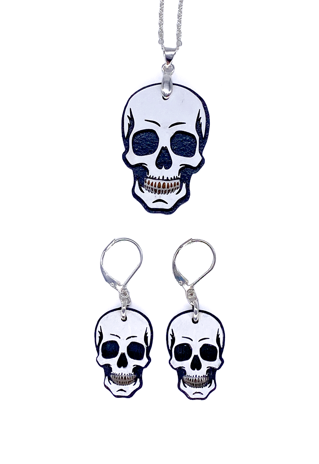 Hand-painted skull necklace and earrings shown together as a matching wood jewelry set.