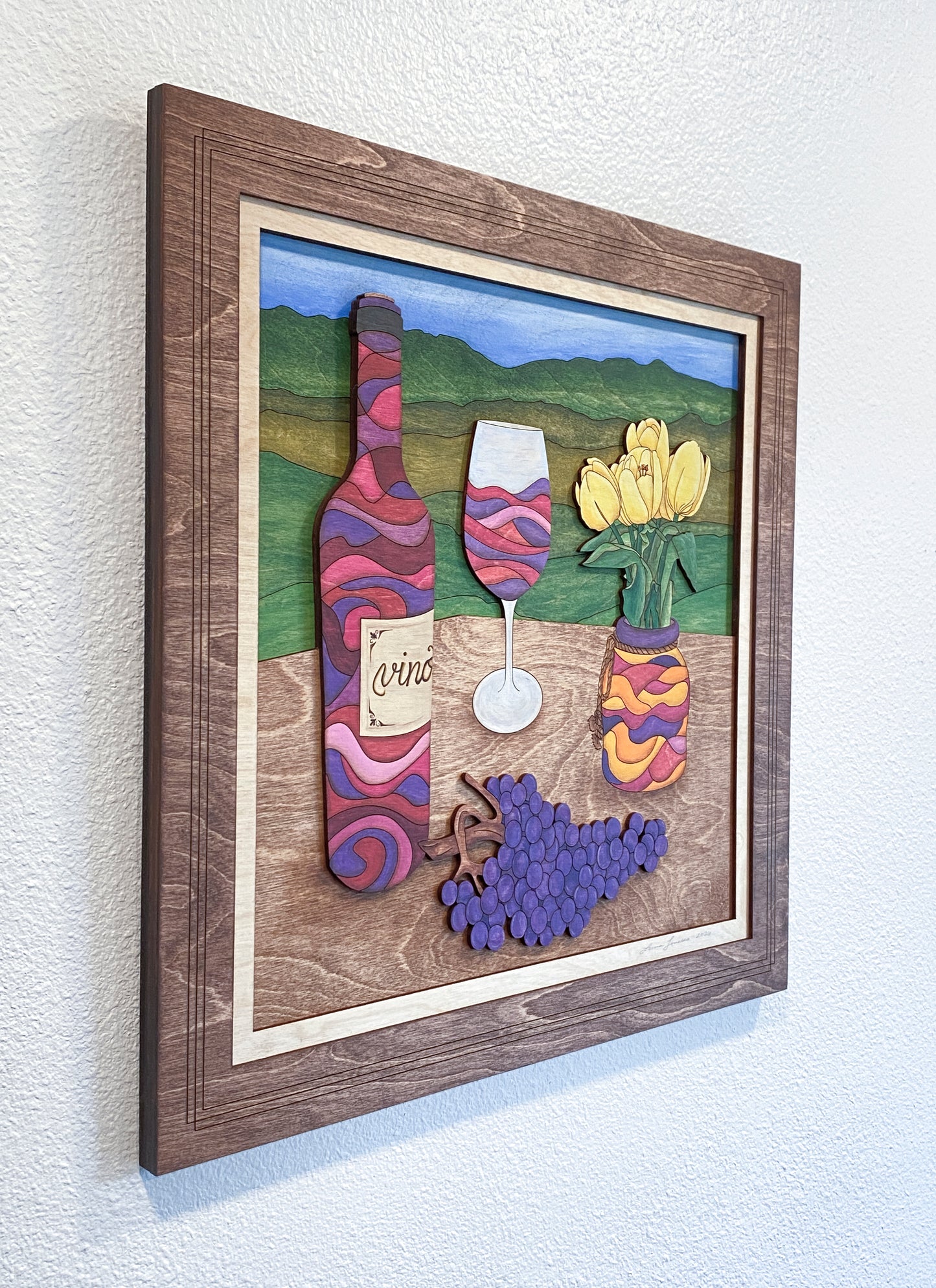 Angled view of Wine and Tulips layered wood wall art highlighting sculptural depth, stained frame, and dimensional layering.