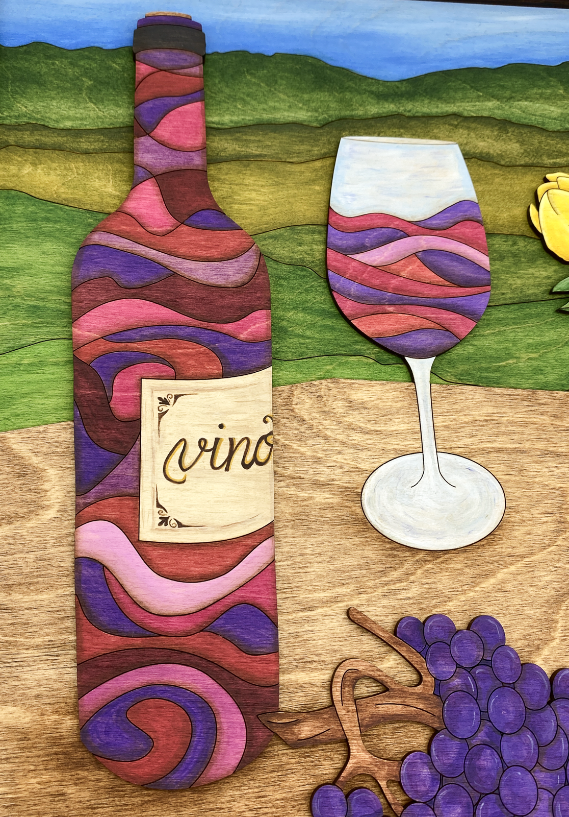Close-up detail of hand-painted wine bottle and patterned still life elements in Wine and Tulips original wood artwork.
