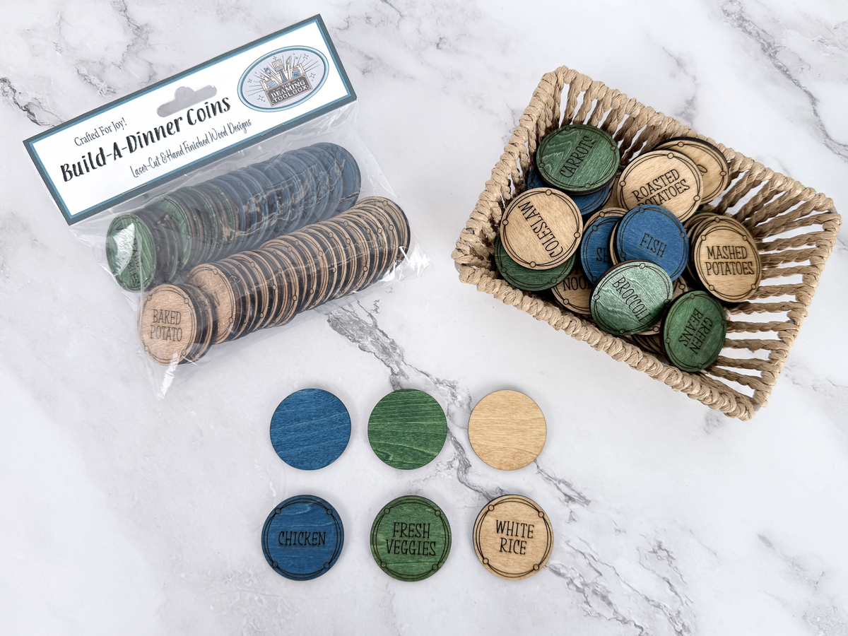 Packaged Build-A-Dinner Coins beside a basket of meal choices with blue, green, and natural wood color categories displayed.