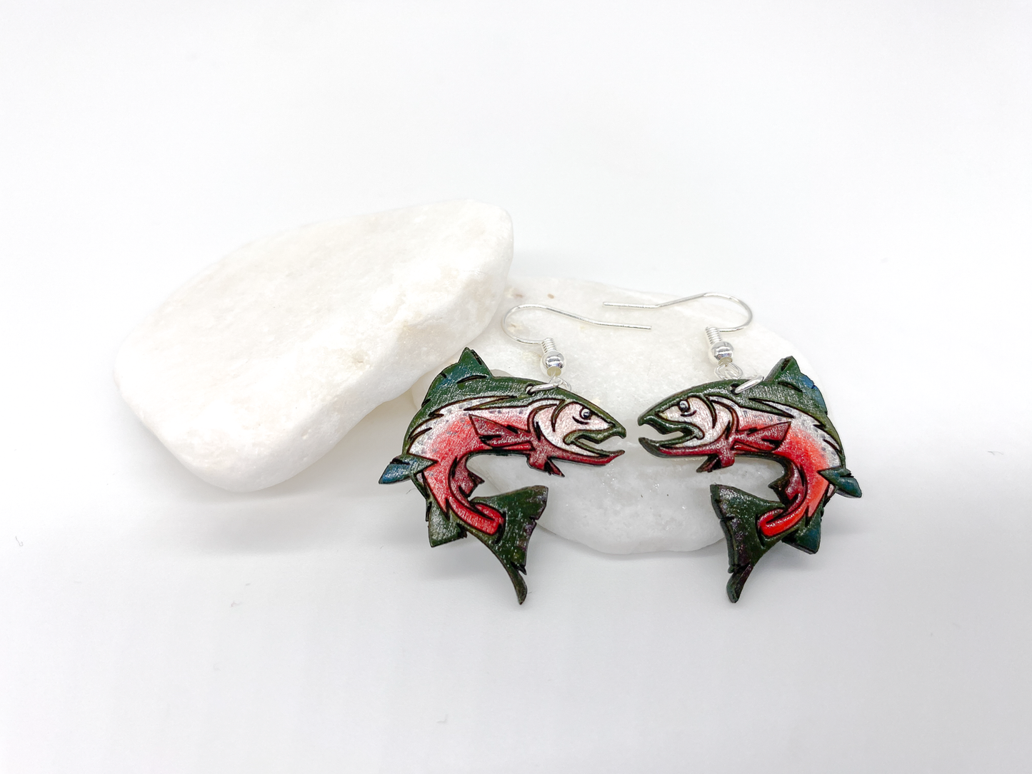 Stylized hand-painted wooden jumping salmon earrings in green and silver